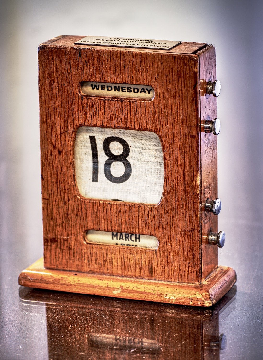 A manual perpetual calendar remains stuck on March 18, signifying when the COVID-19 shut down took hold.